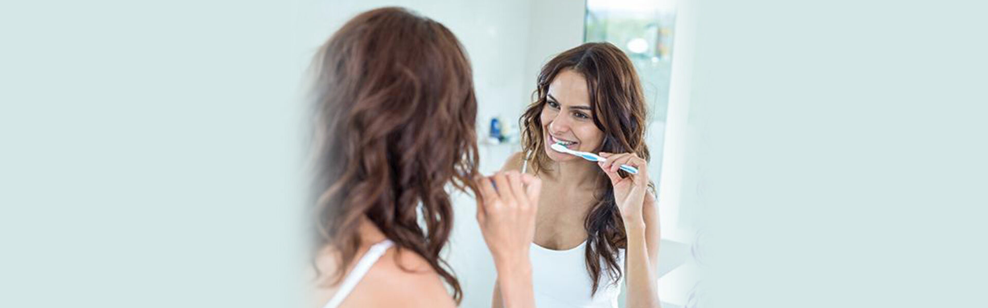 Ease up on your gums — don’t brush your teeth too hard!